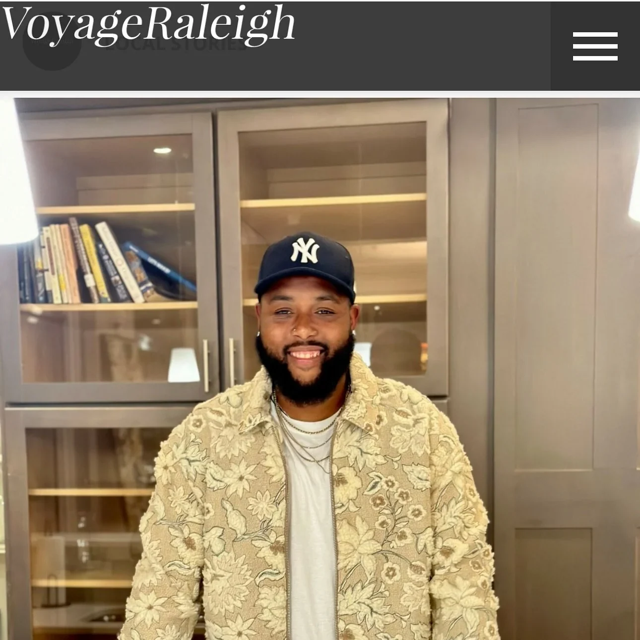 Portrait of Chef Groove wearing a Yankees cap and patterned jacket